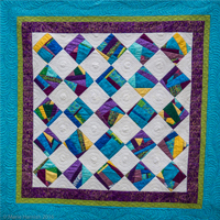 Visit Marie Harnish's Creations in Color quilt making website. This site is creted and run by Karla.